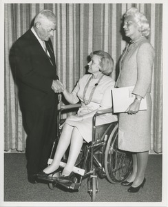 Margaret Milbank Bogert with an unidentified man and a woman seated in a wheelchair