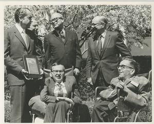 Richard M. Nixon, accompanied by Harold Russell and two other men, presents the 1970 President's Trophy to Richard and Robert Santin