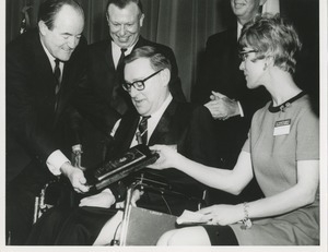 Vice President Hubert Humphrey presents Max C. Rheinberger, Jr. with the 1967 President's Trophy