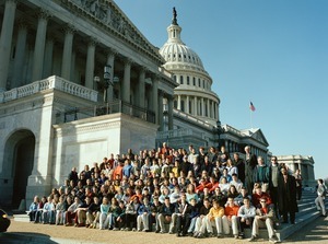 Congressman John W. Olver with group of visitors, posed on the steps of the United States Capitol building