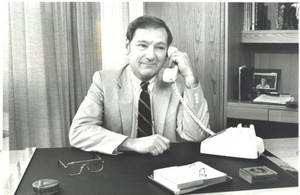 John E. Danielson sitting at his desk