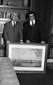 Mayor Kevin White posing with unidentified man and painting