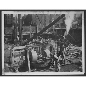 Builders working on a foundation at a construction site