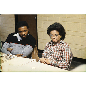 Man and woman attending a meeting