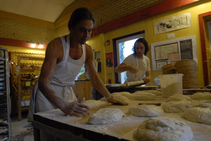 Hungry Ghost Bread: owner and baker Jonathan C. Stevens preparing bread dough