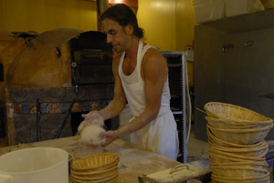 Hungry Ghost Bread: owner and baker Jonathan C. Stevens shaping loaves for baking