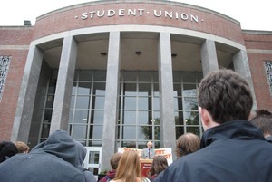 Congressman John W. Olver in front of the UMass Amherst Student Union Building, waiting to speak to rally against student loan debt