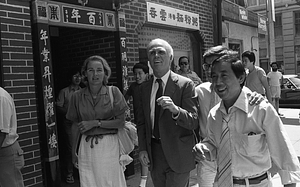 Mayor Kevin White and Kathryn White walk with Frank Chin and Billy Chin through Chinatown during the 1979 August Moon Festival