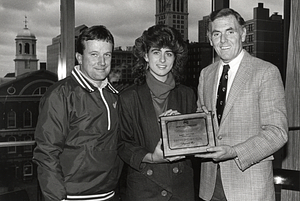 Mayor Raymond L. Flynn presenting Mayor's Sportmanship Award for 1985-1986 to unidentified young woman