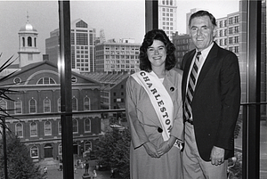 Mayor Raymond L. Flynn and unidentified young woman wearing a Charlestown banner