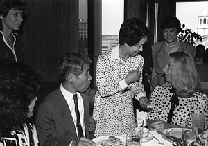 City Councilor Maura Hennigan speaking with an unidentified woman while others look on