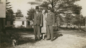 Myself, my mother, and my stepfather in front of our house