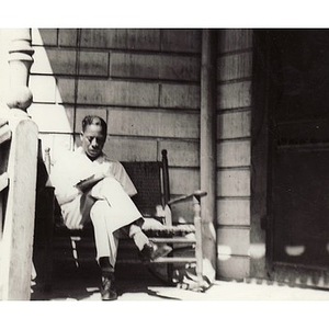 Reverend Dr. Wm. Frederick Fisher takes notes in a book