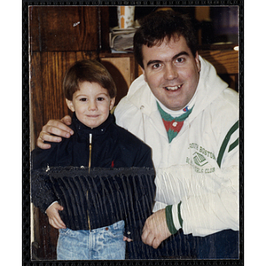 A man posing with a boy at a joint Charlestown Boys & Girls Club and Charlestown Against Drugs (CHAD) event