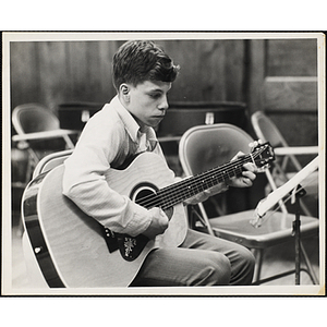 A Boys' Clubs of Boston member playing guitar