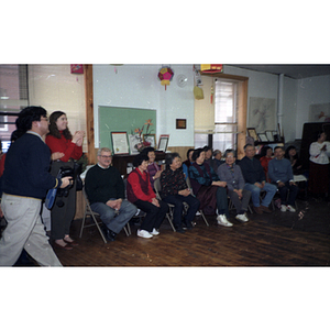 Guests watch a performance at the Chinese Progressive Association's celebration of the Chinese New Year