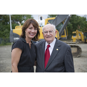 Dr. George J. Kostas stands with a woman at the groundbreaking site for the George J. Kostas Research Institute for Homeland Security, located on the Burlington campus of Northeastern University