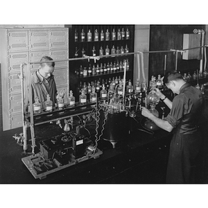 Two students in a chemistry laboratory