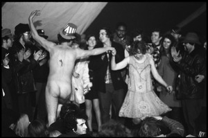 Yippies on stage at the Counter-inaugural Ball, 1969: a naked man in Uncle Sam hat dances with a woman in a flapper outfit