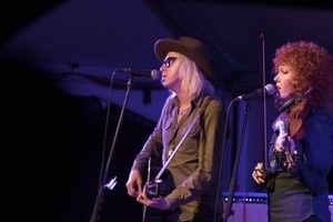 Chris Masterson (guitar) and Eleanor Whitmore (fiddle) performing onstage with Steve Earle and the Dukes at the Payomet Performing Arts Center