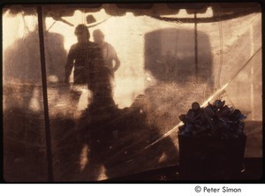 MUSE concert and rally: view of stage through plastic at the No Nukes rally, eating