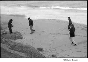 Marcia Braun (left) on the beach with three others, possibly Clif Garboden (far right)