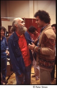 Ram Dass speaking with a man after a lecture at Boston University