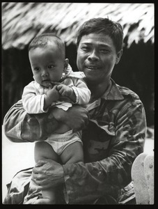 Soldier father with infant son