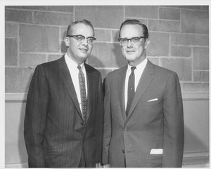 John W. Lederle standing indoors with U.S. Senator Philip Hart