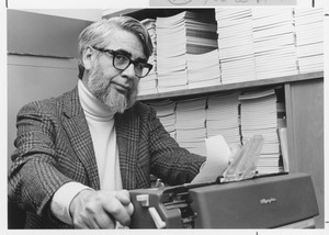 Everett Harvey Emerson sitting indoors, working at desk