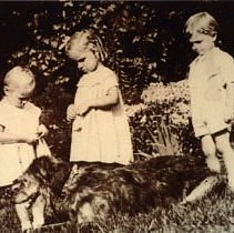 Three children with a dog
