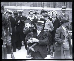 Michael H. Crowley toting a toddler