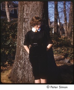 Lucy Simon posing in front of a tree