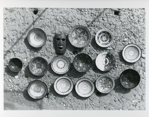 Plates and mask near kasbah