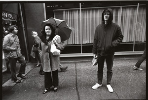 Vietnam Veterans Against the War demonstration 'Search and destroy': man and woman watching demonstration on Washington Street