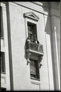 May Day demonstrations and street actions by the Justice Department: people on balcony of Justice Department building, observing