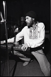 Beach Boys at Boston College: Mike Love kneeling with keyboard