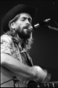 New Riders of the Purple Sage opening for the Grateful Dead at Sargent Gym, Boston University: John 'Marmaduke' Dawson playing acoustic guitar and signing