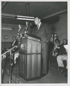 Unidentified man behind podium at Institute Day