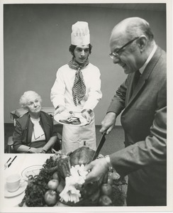 Dr. DiMichael carving turkey