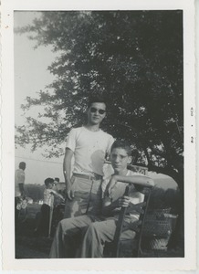 Unidentified young men at outdoor event