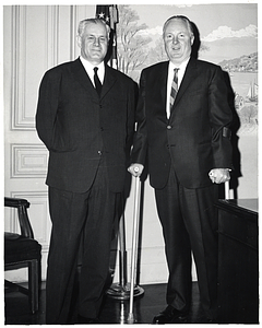 Unidentified Yugoslav leader and Mayor John F. Collins standing in his office