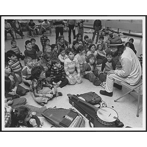 Children and counselor with musical instruments