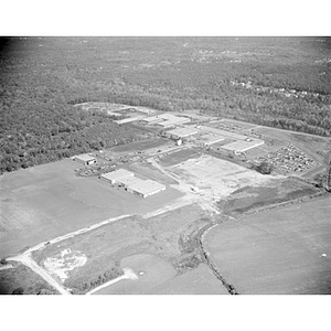 Suburban location of industrial buildings, some new construction, unidentified