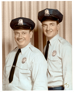 Anthony and Edward Correa in police uniforms