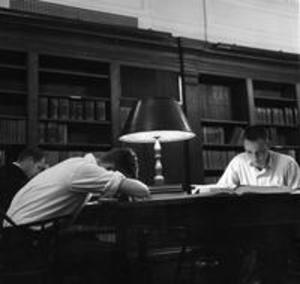 Students studying and sleeping in the Stetson Library reading room