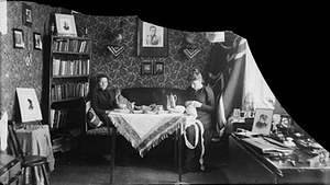 Marie Høeg sits with Tuss and an Unknown Individual at a Table