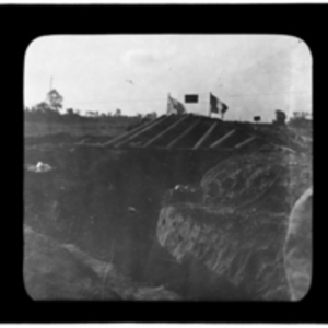 Red Cross and French flags fly above a trench