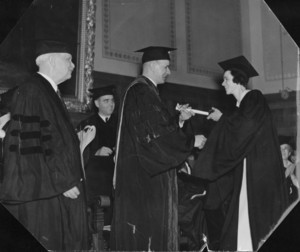 Marian Archer MacDonald (JD 1937), the first woman to graduate from Suffolk University Law School, receives degree from her father, Gleason L. Archer