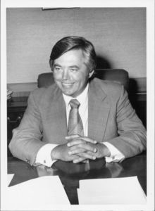 Suffolk University President David J. Sargent (1989-2010) seated behind desk